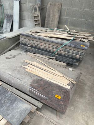 many pieces of wood sitting on the floor in a room