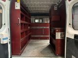 a white van with a red door and shelves in the back