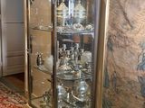 a glass display case in the corner of a room