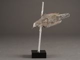 an image of a sculpture of a bird on a black stand