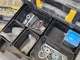 a tool box with tools in it sitting on the floor