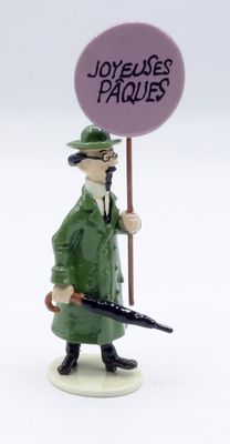a figurine of a man in a green coat and hat holding an umbrella