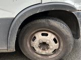 a white van that has a flat tire on it