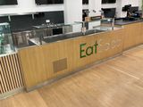 an image of a restaurant with a counter and a coffee machine