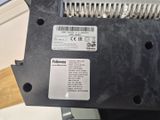 a label on the back of a machine that is sitting on a table