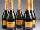 four bottles of canti champagne are lined up in a row