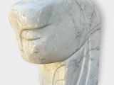 marble sculpture of a woman ' s head on a white background