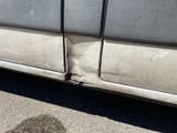 a close up of a car ' s door and side of the car