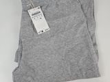 a pair of grey pants with a tag on them