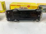 three toy trains sitting next to each other on a table