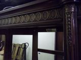 a mirror in the middle of a room with a mirror on the wall