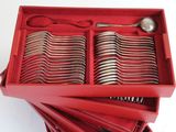 a lot of spoons and spoons in a red box