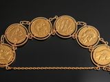 an image of a gold coin bracelet with a padlock on it