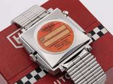 a watch that is sitting on top of a red box
