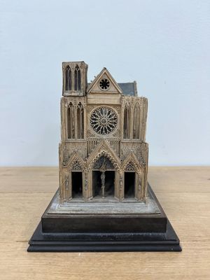 an image of a model of a church on a wooden table