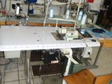 an image of a sewing machine in a factory