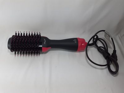 a black and red brush with a red handle on a white surface