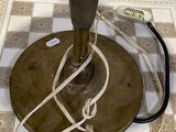 a lamp that is sitting on a tile floor