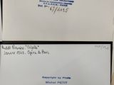 three white envelopes with blue ink on them sitting on a table
