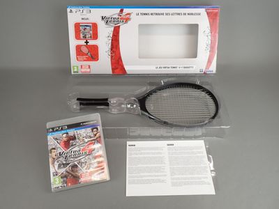a tennis racquet and a video game on the table