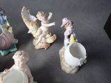 five figurines that are sitting on a table