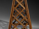an old wooden wine rack with a lattice design on it