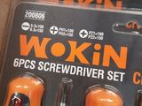 two orange and black screwdrivers are in a box
