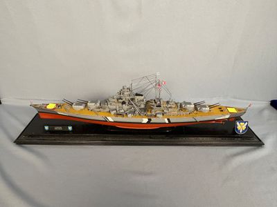 a model of a battleship on display on a table