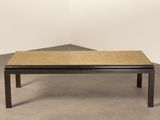 an image of a coffee table with a wooden top on a concrete floor