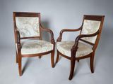 two chairs with upholstered upholstered back and arms