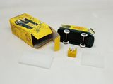 a skateboard in a box and a pair of tape