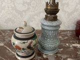 two vases that are sitting on a table