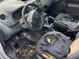 the interior of a car with a bunch of luggage in it