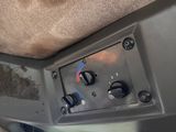 a close up of a car dashboard with a control panel