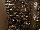 many bottles of wine on the racks in the room