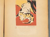 an old book with a picture of a woman and a cat on it