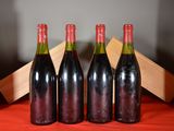three bottles of wine sitting on a table next to each other