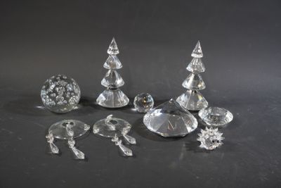 several pieces of crystal on a table with a black background