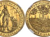 a gold coin with an image of a man holding a sword
