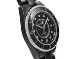 the watch is black and silver with a black face