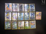 a close up of a bunch of pokemon cards on a table