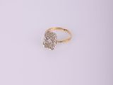 a gold ring with a white diamond in the middle
