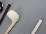 several different types of golf clubs are laid out on a table