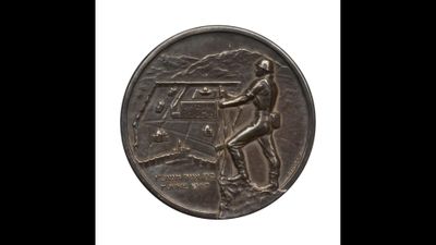 a close up of a coin with a man on it