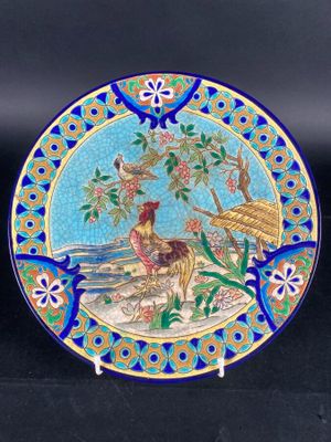 LONGWY. Plat circulaire en céramique émaillée à décor d'un c…