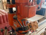a machine that is sitting on top of a pile of wood