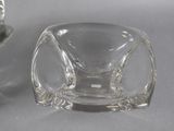 a small glass bowl and a small glass bowl on a table