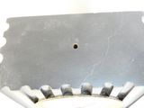 a close up of a metal object with a hole in it