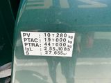 a picture of a green truck with a sticker on it ' s side