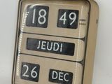 a clock that is sitting on the wall with numbers on it